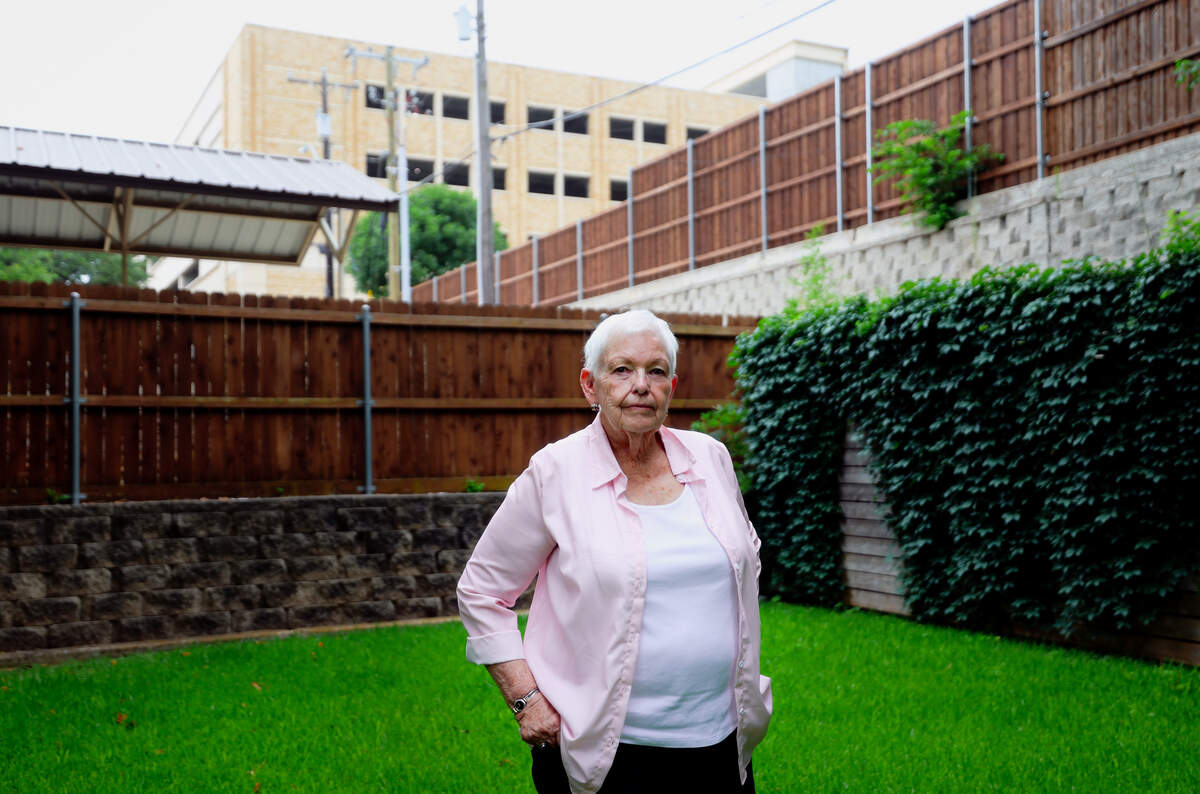As TCU expands to meet a growing student body nearby neighborhoods are changing, creating friction with long-term residents. A parking garage being built behind Martha Latta’s home has caused noise, dirt and traffic issues, she says. Photographed Tuesday, June 16, 2026.